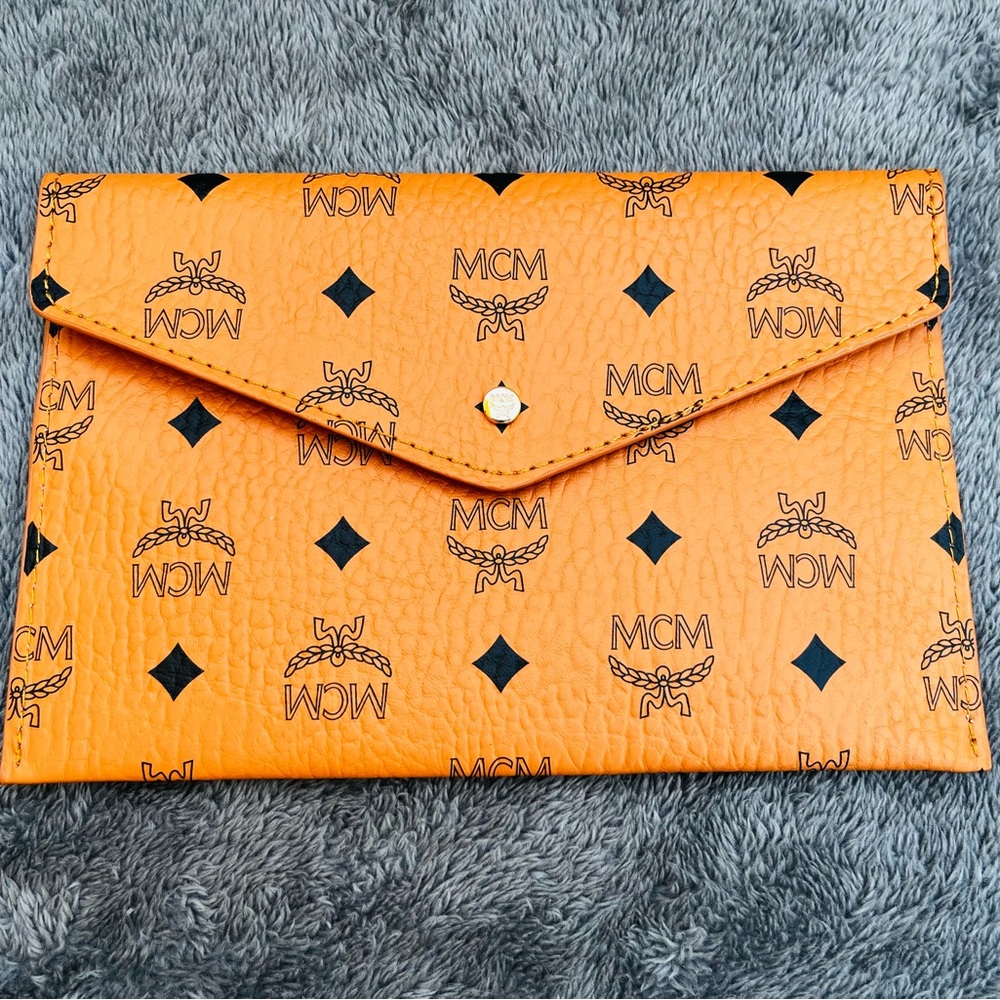 MCM Orange Clutch with Signature Monogram